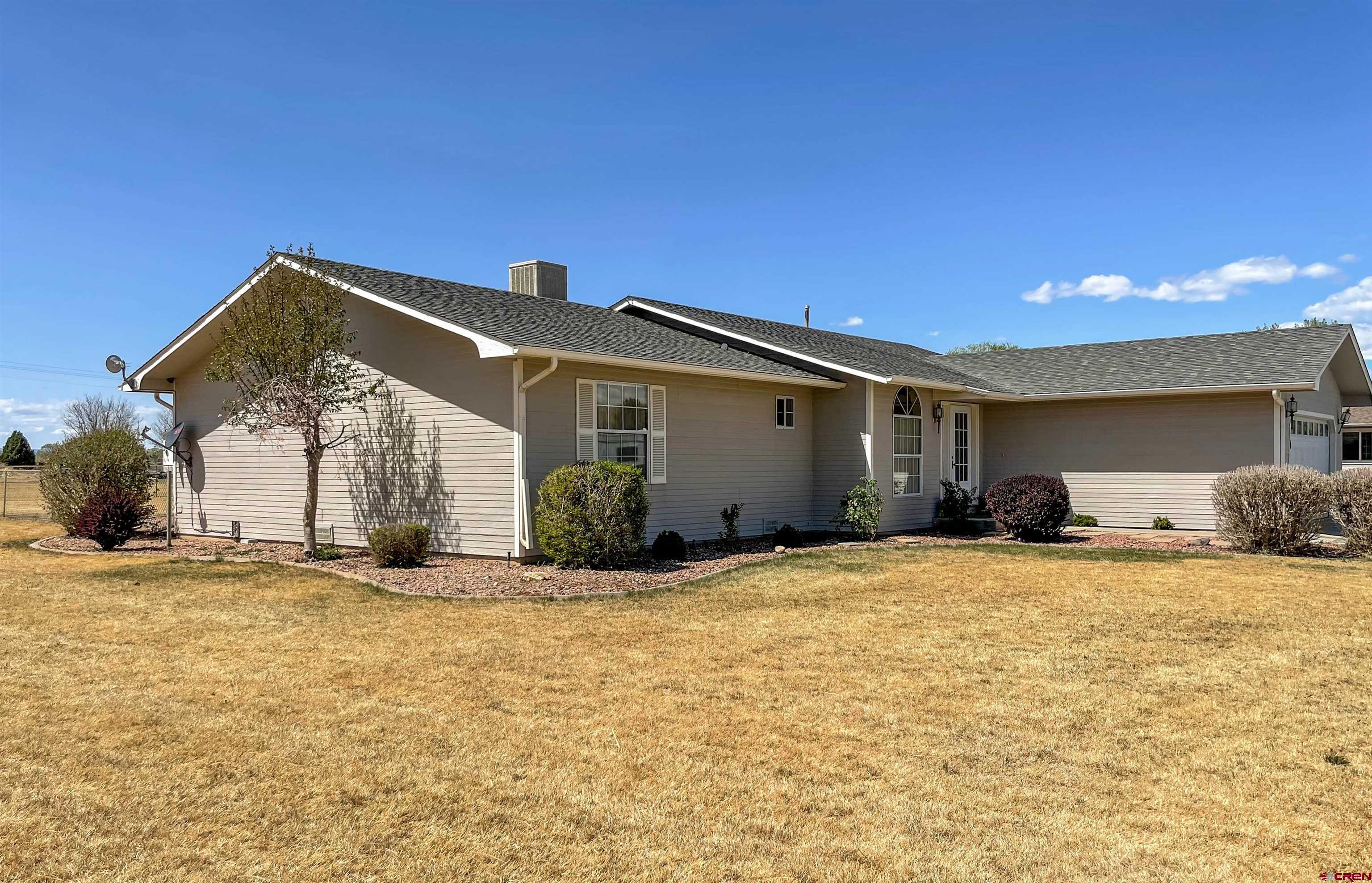 2535 1585 Road Delta, CO 81416 - Photo 35 of 35 a view of a house with a yard
