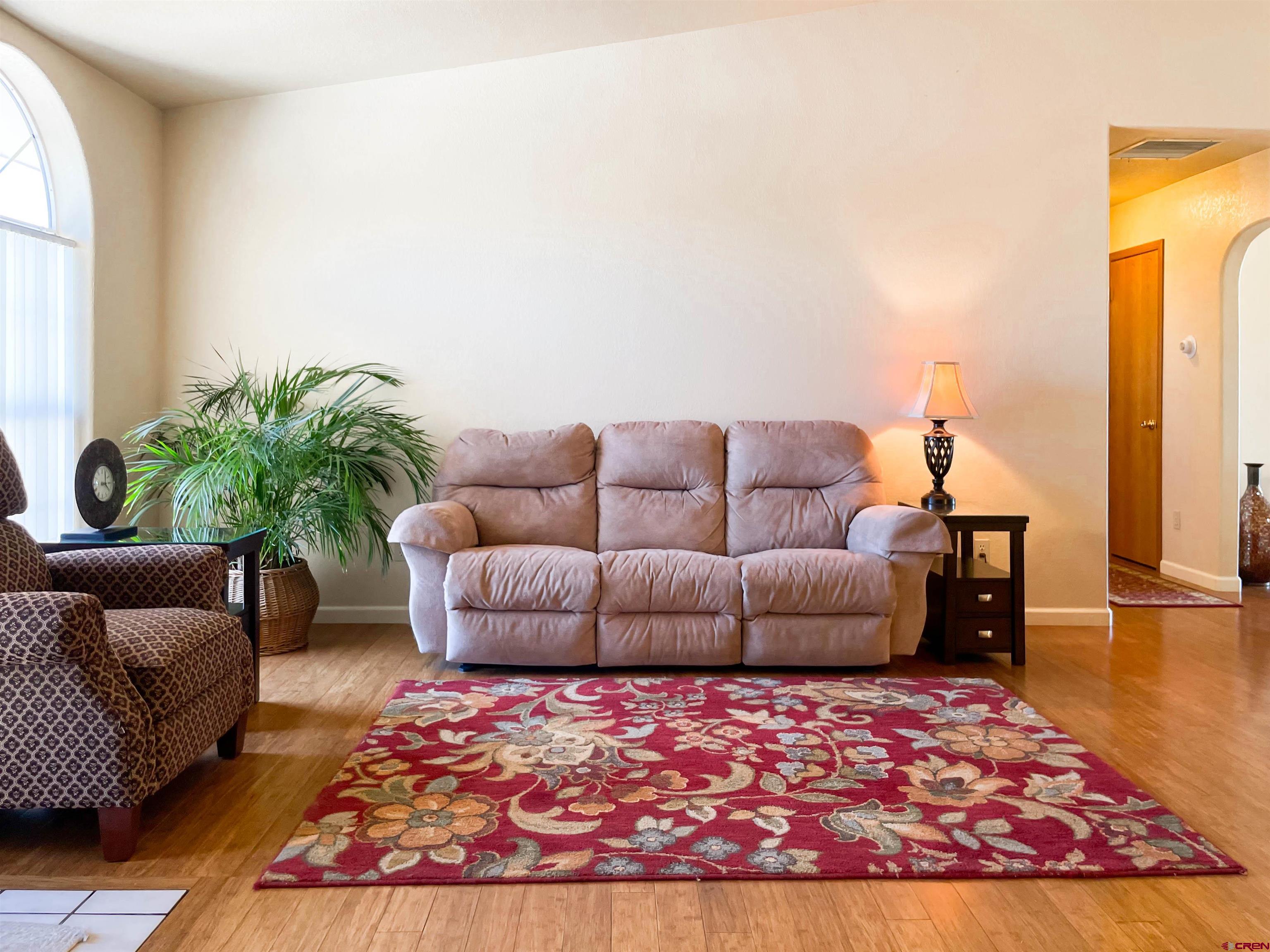 2535 1585 Road Delta, CO 81416 - Photo 6 of 35 a living room with furniture and a rug