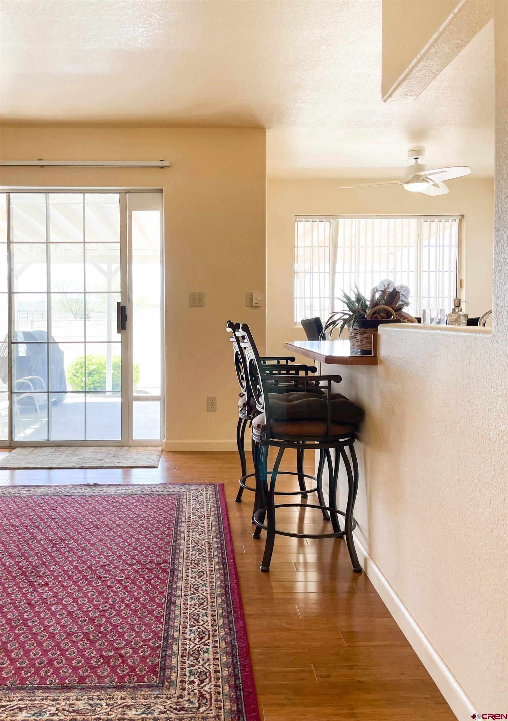 2535 1585 Road Delta, CO 81416 - Photo 7 of 35 a view of a dining room with furniture and wooden floor