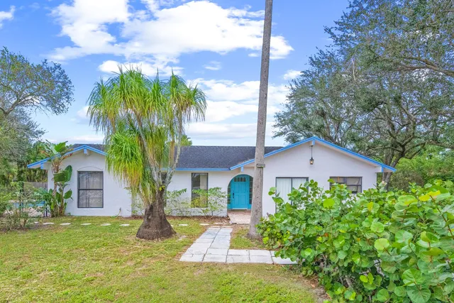 a view of a garden with wooden fence