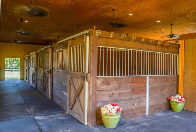 a outdoor space with pool and trees in the background