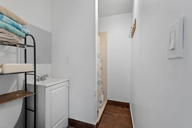 a green field with trees in the background