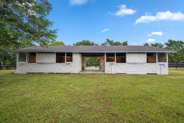 a view of a yard with swimming pool