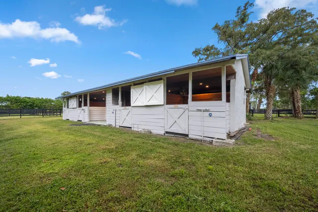 a view of outdoor space with swimming pool and trees