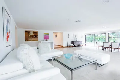 a bedroom with a bed dresser and a window