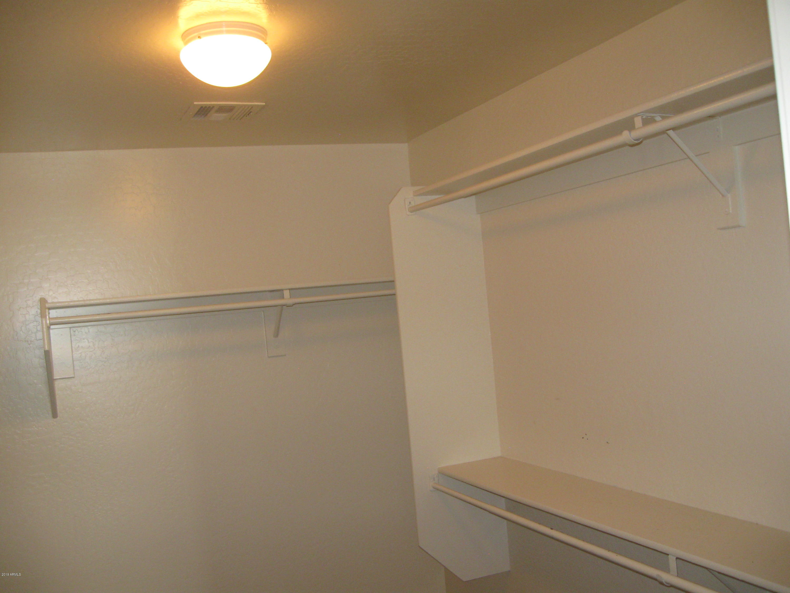 8746 West Heber Road Tolleson, AZ 85353 - Photo 20 of 36 a bathroom with a shower and a toilet