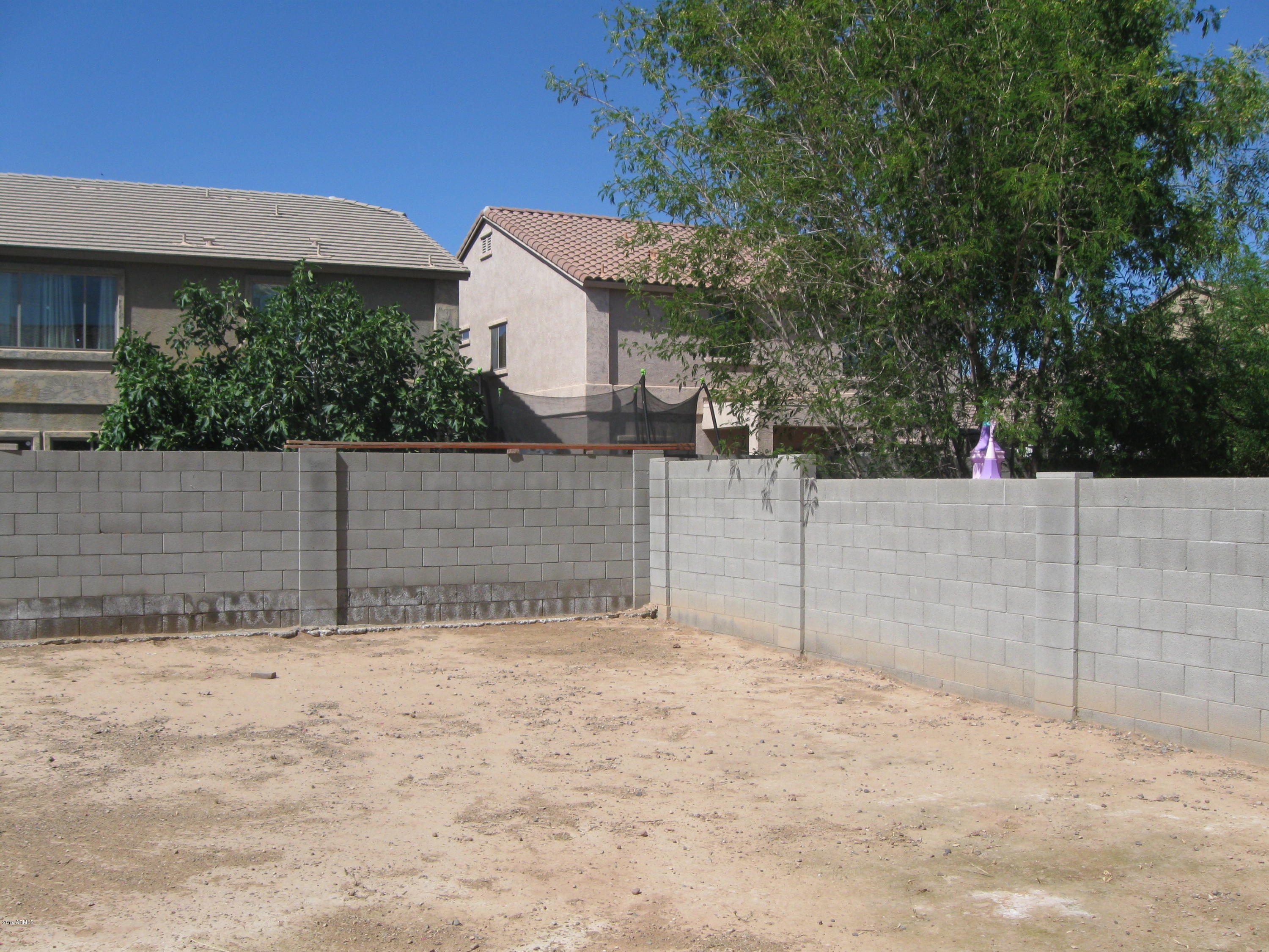 8746 West Heber Road Tolleson, AZ 85353 - Photo 34 of 36 a view of a fence