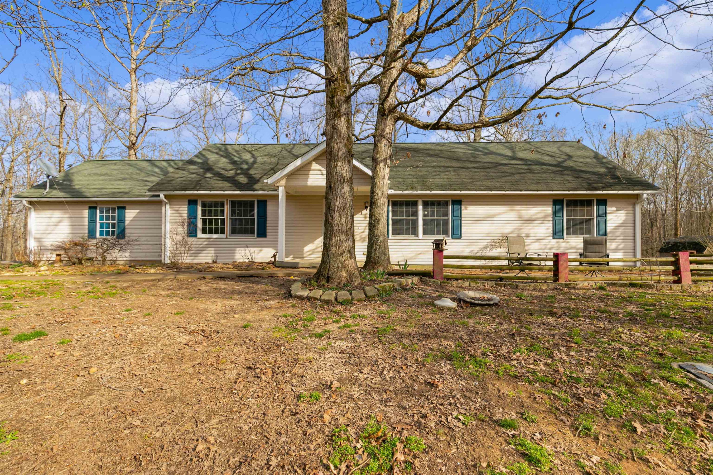 208 Stan Lane Cedar Grove, TN 38321 - Photo 1 of 19 a front view of a house with garden