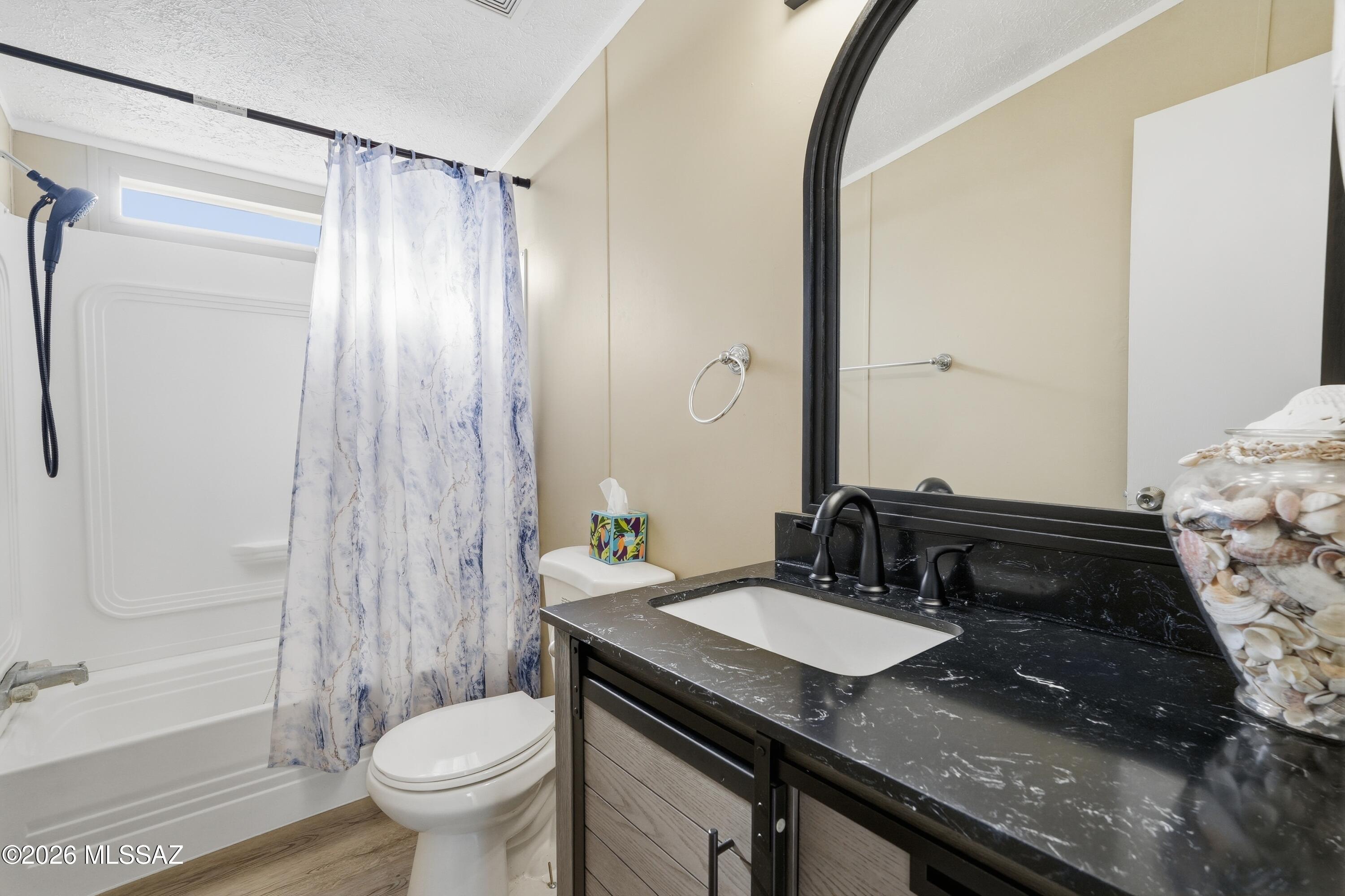 15680 East Colossal Cave Road Vail, AZ 85641 - Photo 26 of 51 Updated floors, vanity, mirror, light and faucet.