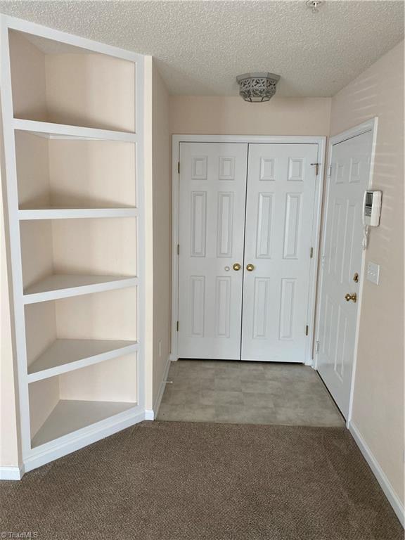 140 James Road, Unit 1A High Point, NC 27265 - Photo 16 of 16 Built-in shelving and storage closet.