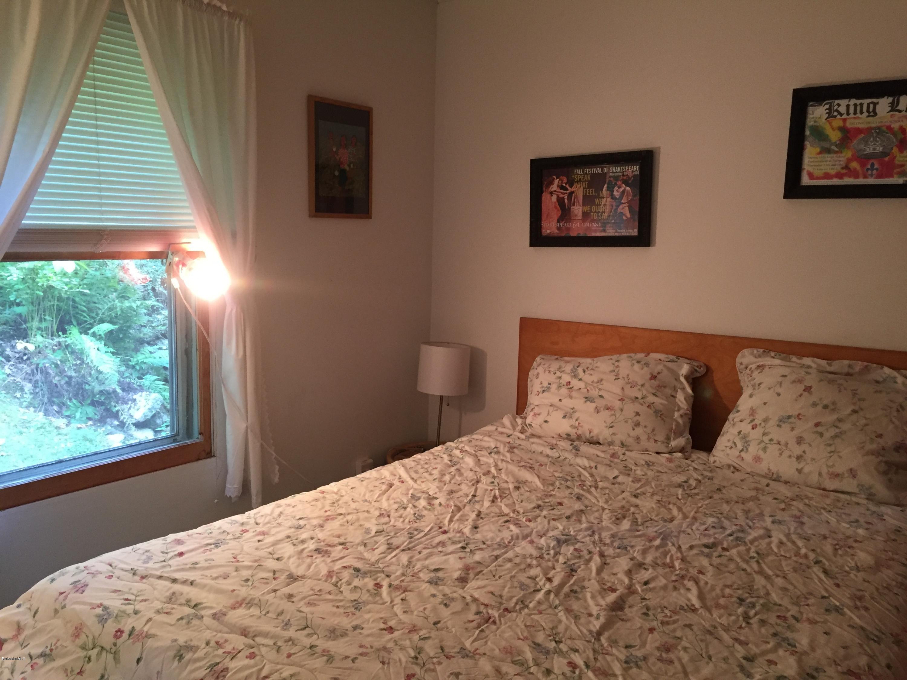 10 Mahkeenac Heights Road Stockbridge, MA 01262 - Photo 14 of 22 a bedroom with a large bed and a window