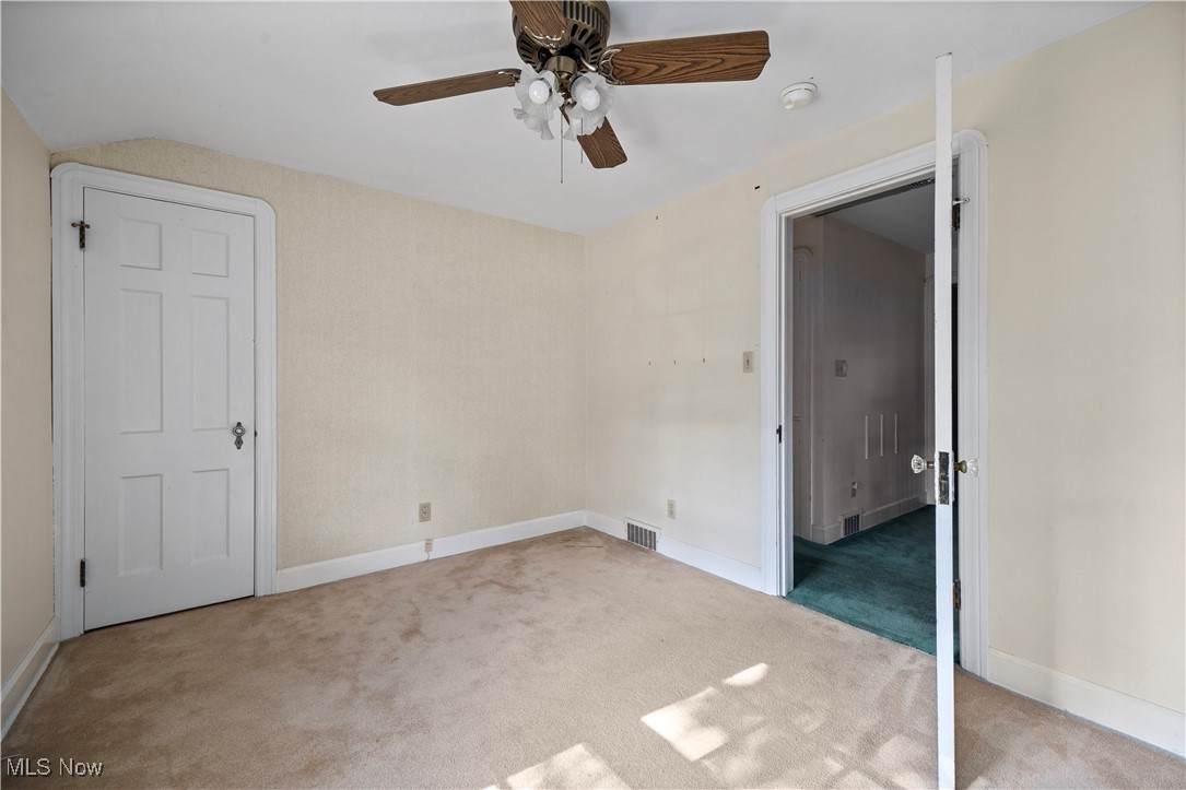976 Gulf Road Elyria, OH 44035 - Photo 22 of 43 Unfurnished bedroom featuring light colored carpet and a ceiling fan