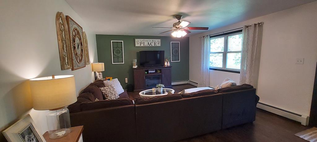 1647 Hells Kitchen Road Stoneboro, PA 16153 - Photo 17 of 19 a living room with furniture and a flat screen tv