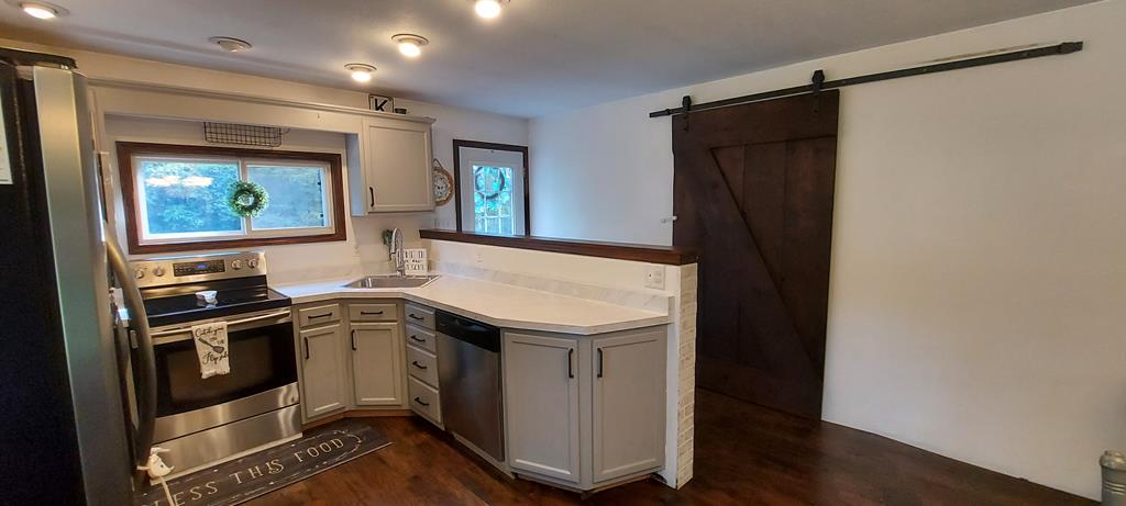 1647 Hells Kitchen Road Stoneboro, PA 16153 - Photo 18 of 19 a kitchen with a sink appliances and cabinets
