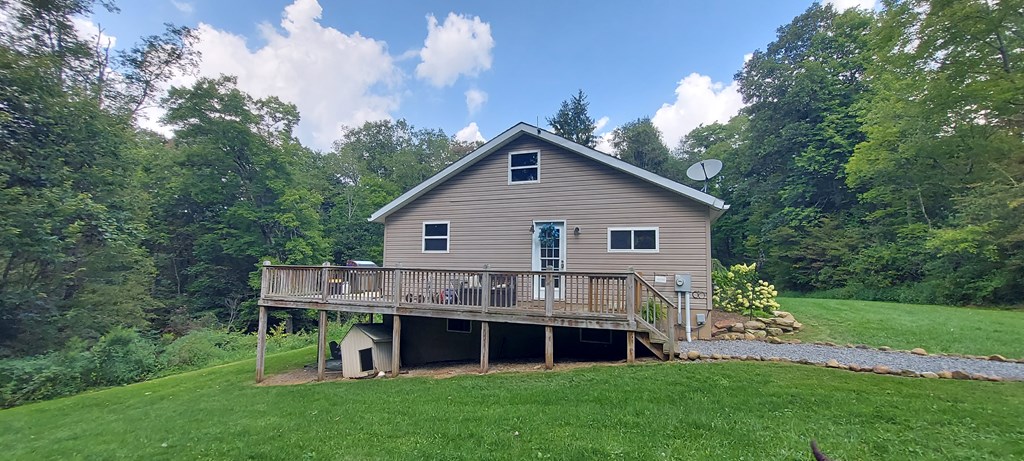 1647 Hells Kitchen Road Stoneboro, PA 16153 - Photo 3 of 19 a front view of a house with a garden and yard