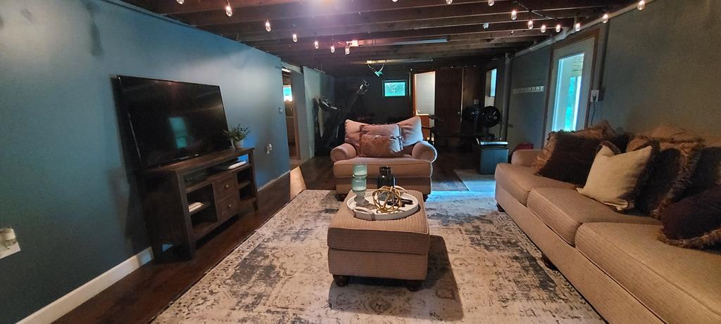 1647 Hells Kitchen Road Stoneboro, PA 16153 - Photo 8 of 19 a living room with furniture and a flat screen tv