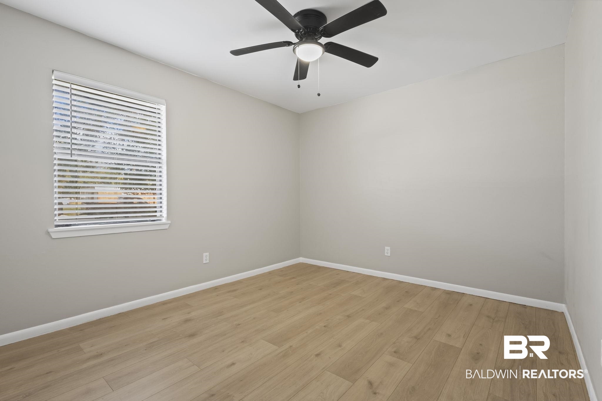 309 West Roosevelt Avenue Foley, AL 36535 - Photo 19 of 60 Empty room featuring light hardwood / wood-style floors and ceiling fan