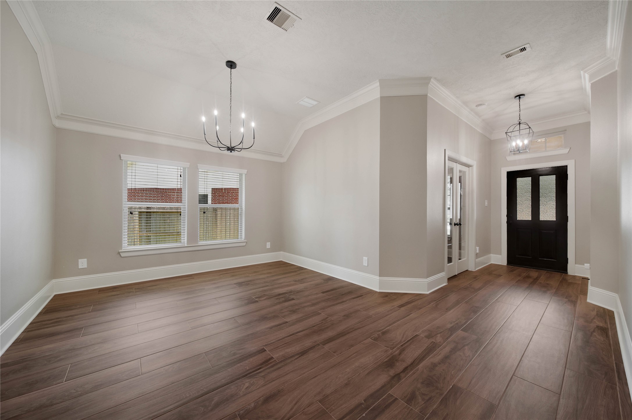 1215 Jake Springs Court Spring, TX 77386 - Photo 5 of 49 The formal dining room is perfect for entertaining! Upgraded light fixtures throughout add to the beauty of this home.