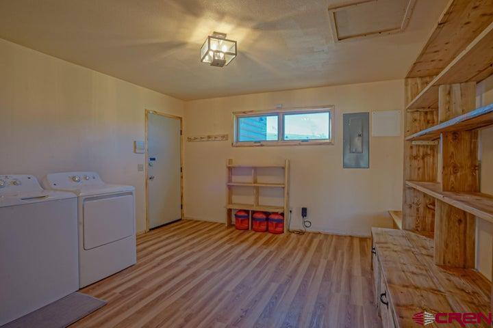 1810 Forbes Park Road Fort Garland, CO 81133 - Photo 15 of 25 a hallway with furniture and wooden floor