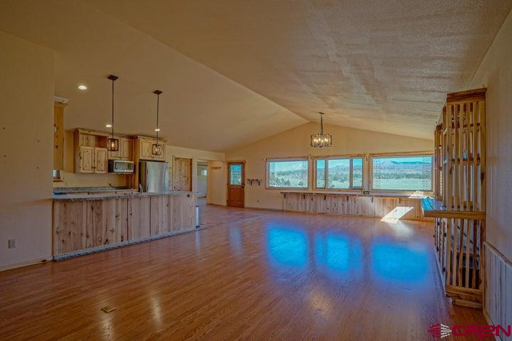 1810 Forbes Park Road Fort Garland, CO 81133 - Photo 17 of 25 a view of empty room with wooden floor and fan