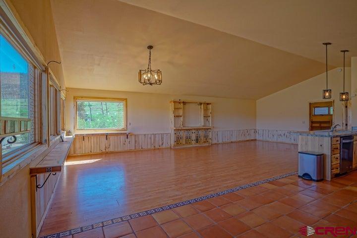 1810 Forbes Park Road Fort Garland, CO 81133 - Photo 18 of 25 a view of a living room and kitchen with a large window