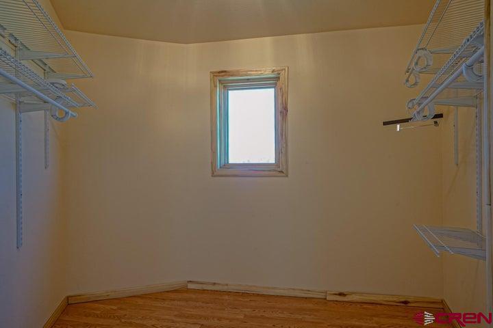 1810 Forbes Park Road Fort Garland, CO 81133 - Photo 23 of 25 a view of a small space with wooden floor and a window