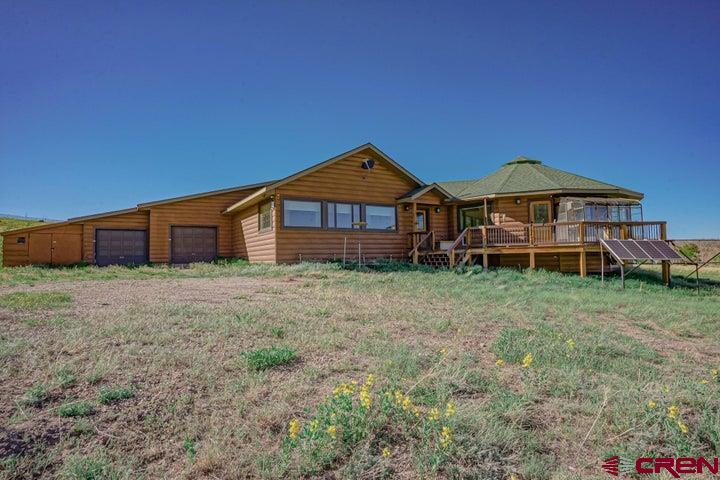 1810 Forbes Park Road Fort Garland, CO 81133 - Photo 6 of 25 a front view of a house with a yard