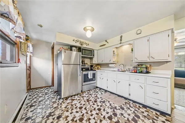 a kitchen with granite countertop cabinets and stainless steel appliances