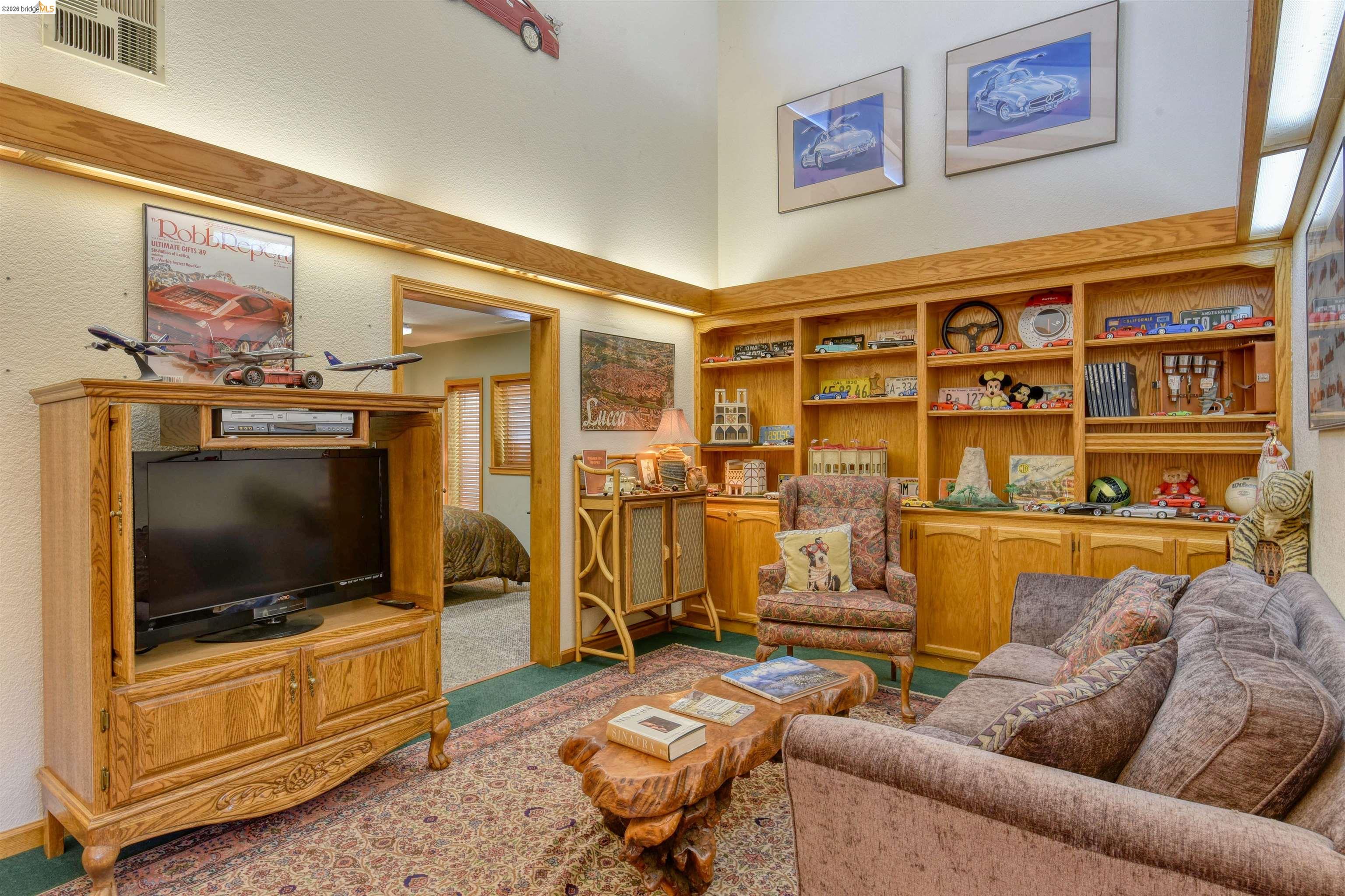 20950 Ferretti Road Groveland, CA 95321 - Photo 13 of 27 a living room with furniture and a flat screen tv