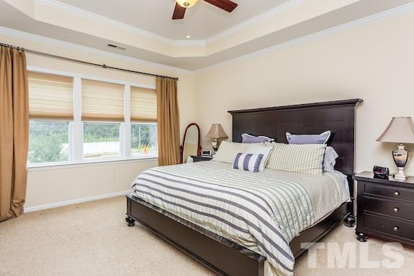 1144 Chapanoke Road Raleigh, NC 27603 - Photo 12 of 22 a bedroom with a bed and a large window