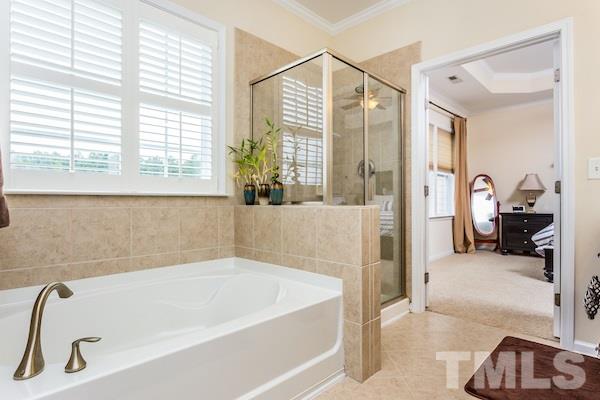 1144 Chapanoke Road Raleigh, NC 27603 - Photo 14 of 22 a bathroom with a tub and a shower