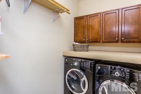 1144 Chapanoke Road Raleigh, NC 27603 - Photo 18 of 22 a view of a utility room with dryer and washer