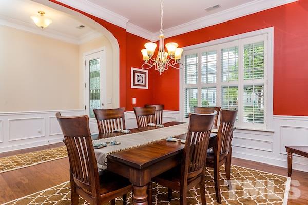 1144 Chapanoke Road Raleigh, NC 27603 - Photo 4 of 22 a view of a dining room with furniture window and outside view
