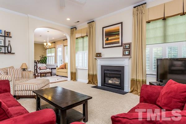 1144 Chapanoke Road Raleigh, NC 27603 - Photo 5 of 22 a living room with furniture or couch and a fireplace