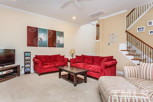 1144 Chapanoke Road Raleigh, NC 27603 - Photo 6 of 22 a living room with furniture and a flat screen tv