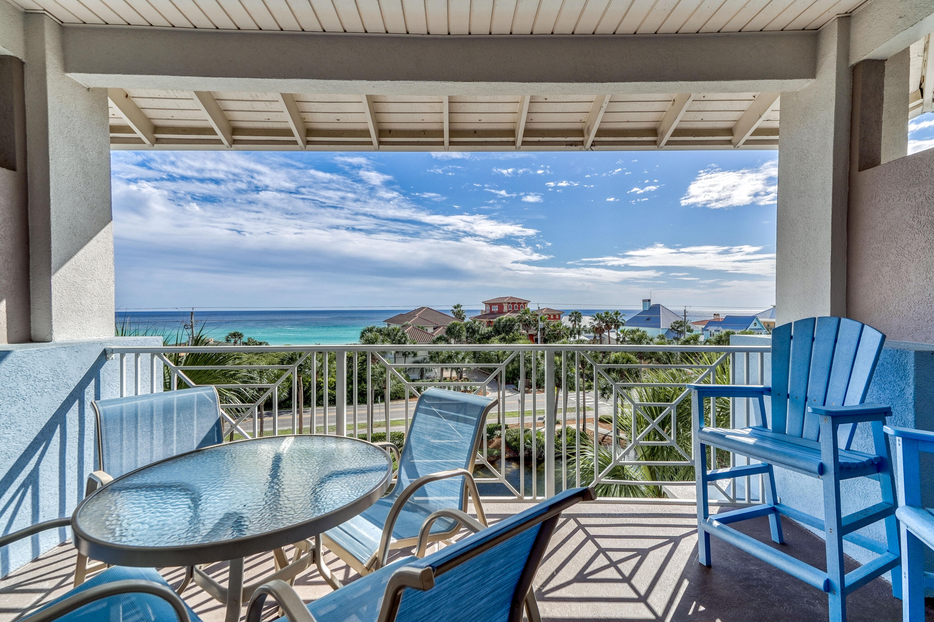 145 Spires Lane, Unit 406 Santa Rosa Beach, FL 32459 - Photo 17 of 38 a balcony with table and chairs