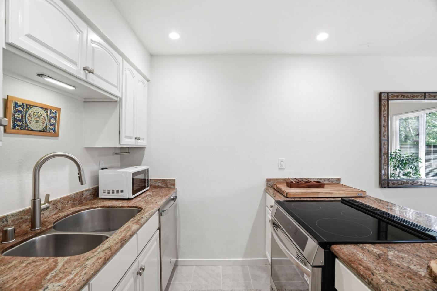 311 Bean Creek Road, Unit 301 Scotts Valley, CA 95066 - Photo 13 of 26 a kitchen with a sink cabinets and window