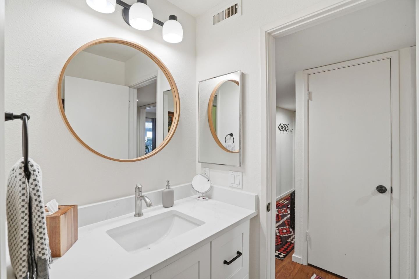 311 Bean Creek Road, Unit 301 Scotts Valley, CA 95066 - Photo 15 of 26 a bathroom with a sink and a mirror