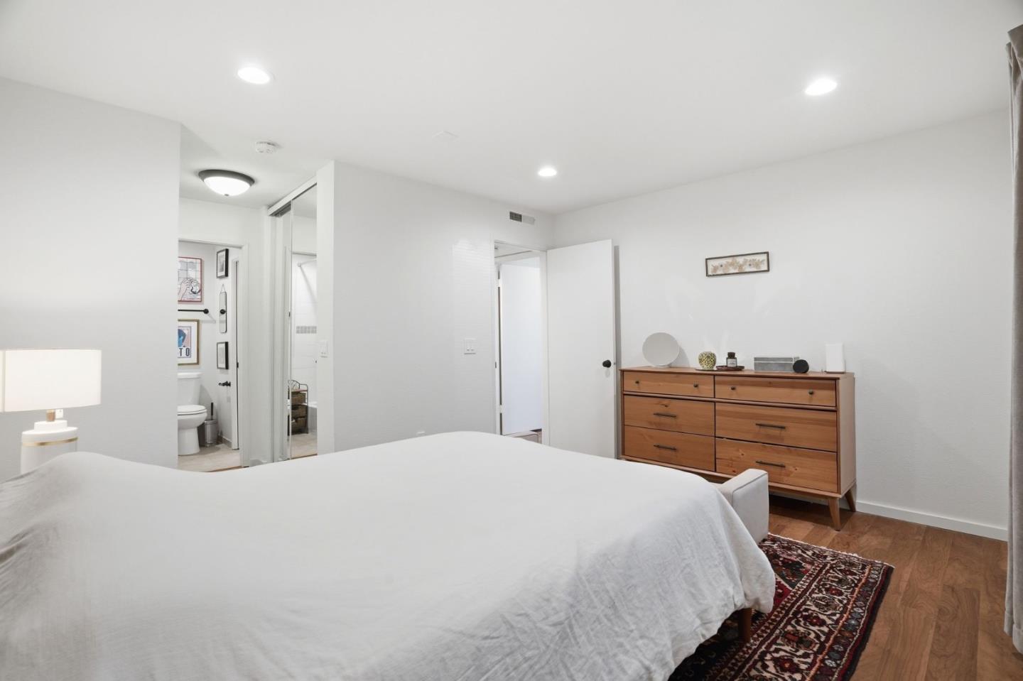 311 Bean Creek Road, Unit 301 Scotts Valley, CA 95066 - Photo 18 of 26 a bedroom with a bed and a dresser