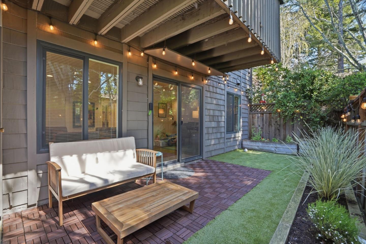 311 Bean Creek Road, Unit 301 Scotts Valley, CA 95066 - Photo 2 of 26 a view of a porch with furniture and a yard