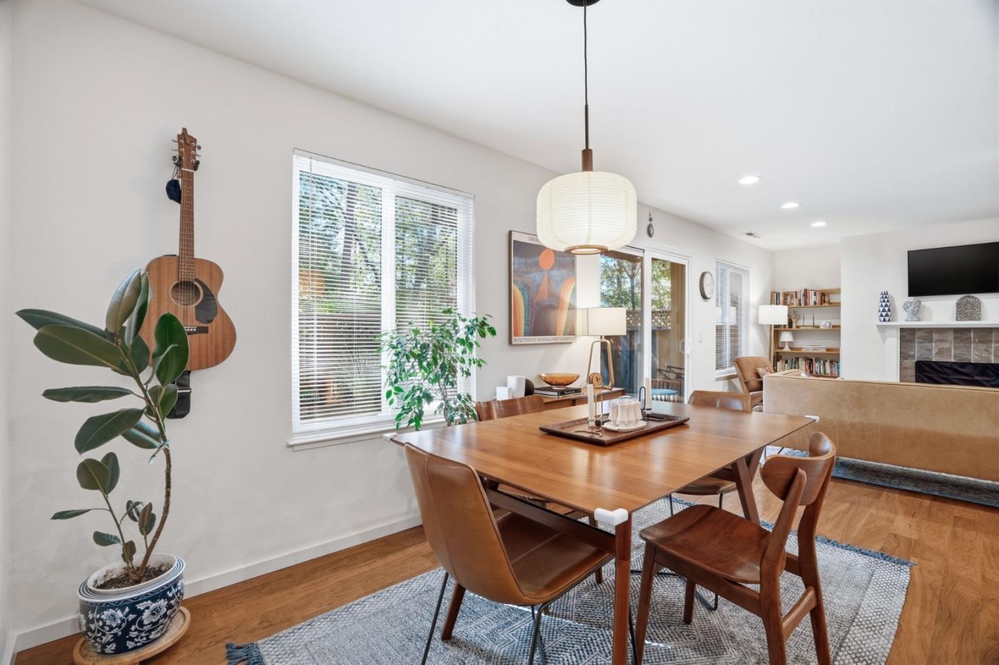 311 Bean Creek Road, Unit 301 Scotts Valley, CA 95066 - Photo 8 of 26 a dining room with furniture potted plants and wooden floor
