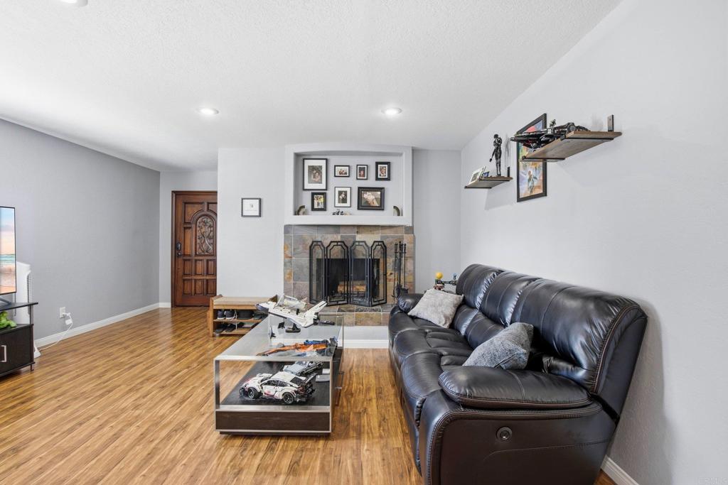1736 San Pasqual Valley Road Escondido, CA 92027 - Photo 12 of 34 a living room with furniture and a fireplace