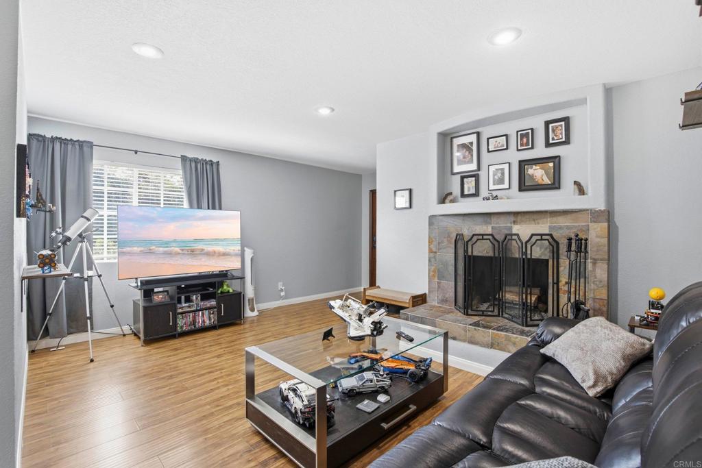 1736 San Pasqual Valley Road Escondido, CA 92027 - Photo 13 of 34 a living room with furniture and a fireplace