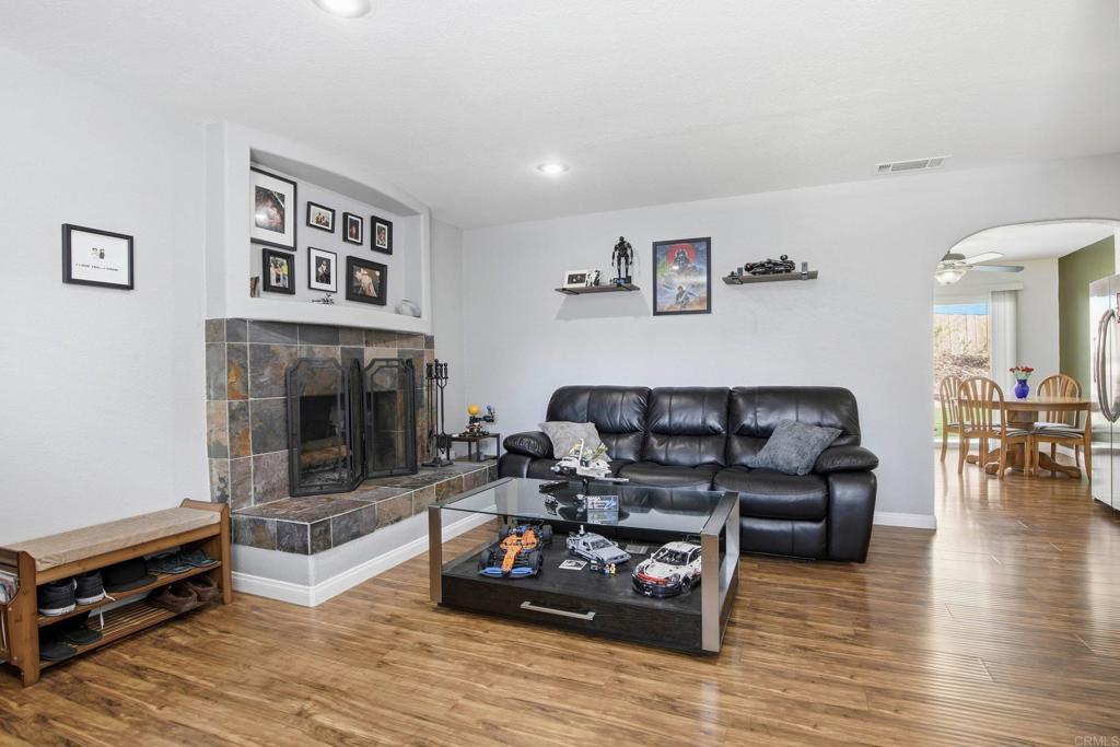1736 San Pasqual Valley Road Escondido, CA 92027 - Photo 14 of 34 a living room with furniture and a fireplace