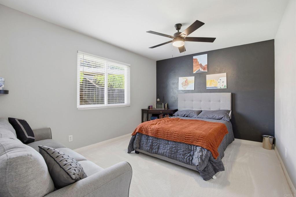 1736 San Pasqual Valley Road Escondido, CA 92027 - Photo 17 of 34 a bedroom with a bed and window