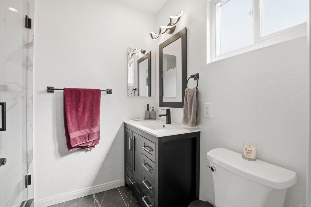 1736 San Pasqual Valley Road Escondido, CA 92027 - Photo 24 of 34 a bathroom with a sink toilet and vanity