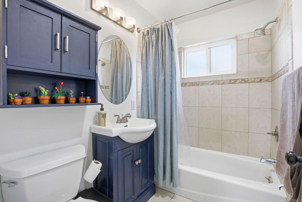 1736 San Pasqual Valley Road Escondido, CA 92027 - Photo 30 of 34 a bathroom with a sink a toilet and shower