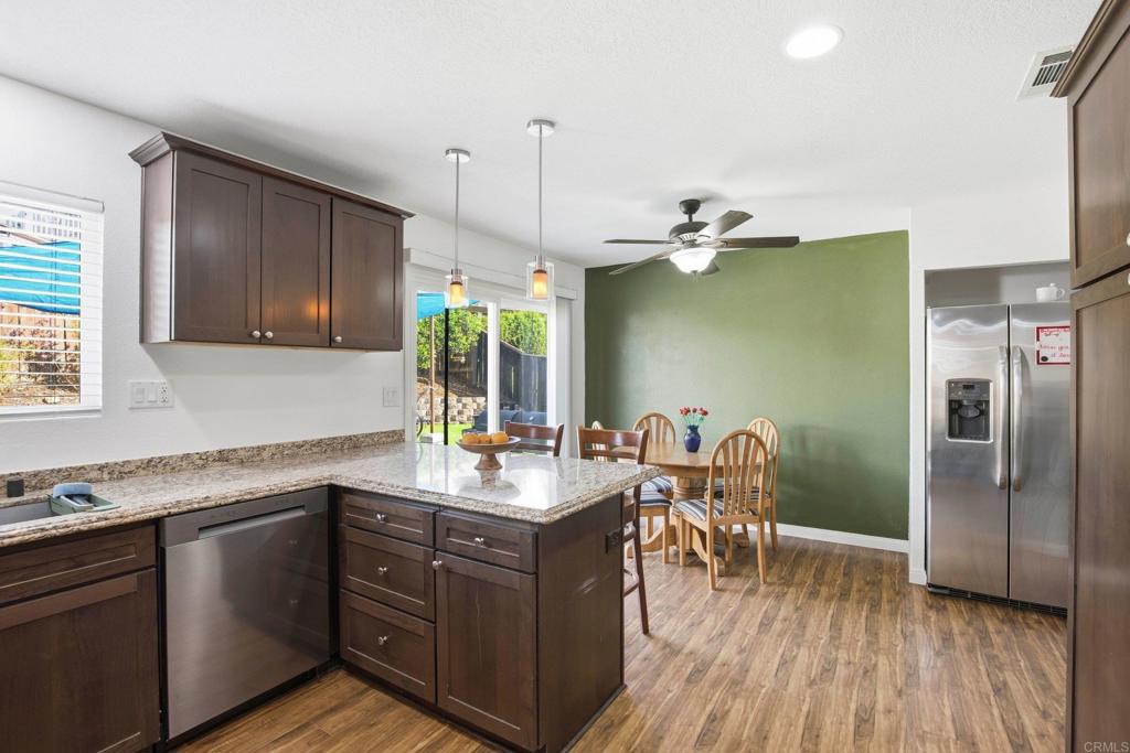 1736 San Pasqual Valley Road Escondido, CA 92027 - Photo 5 of 34 a kitchen with a sink a counter space appliances and cabinets