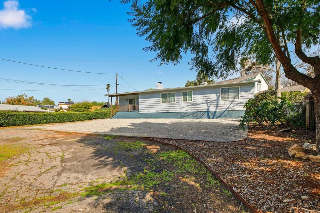 1736 San Pasqual Valley Road Escondido, CA 92027 - Photo 8 of 34 a front view of a house with garden