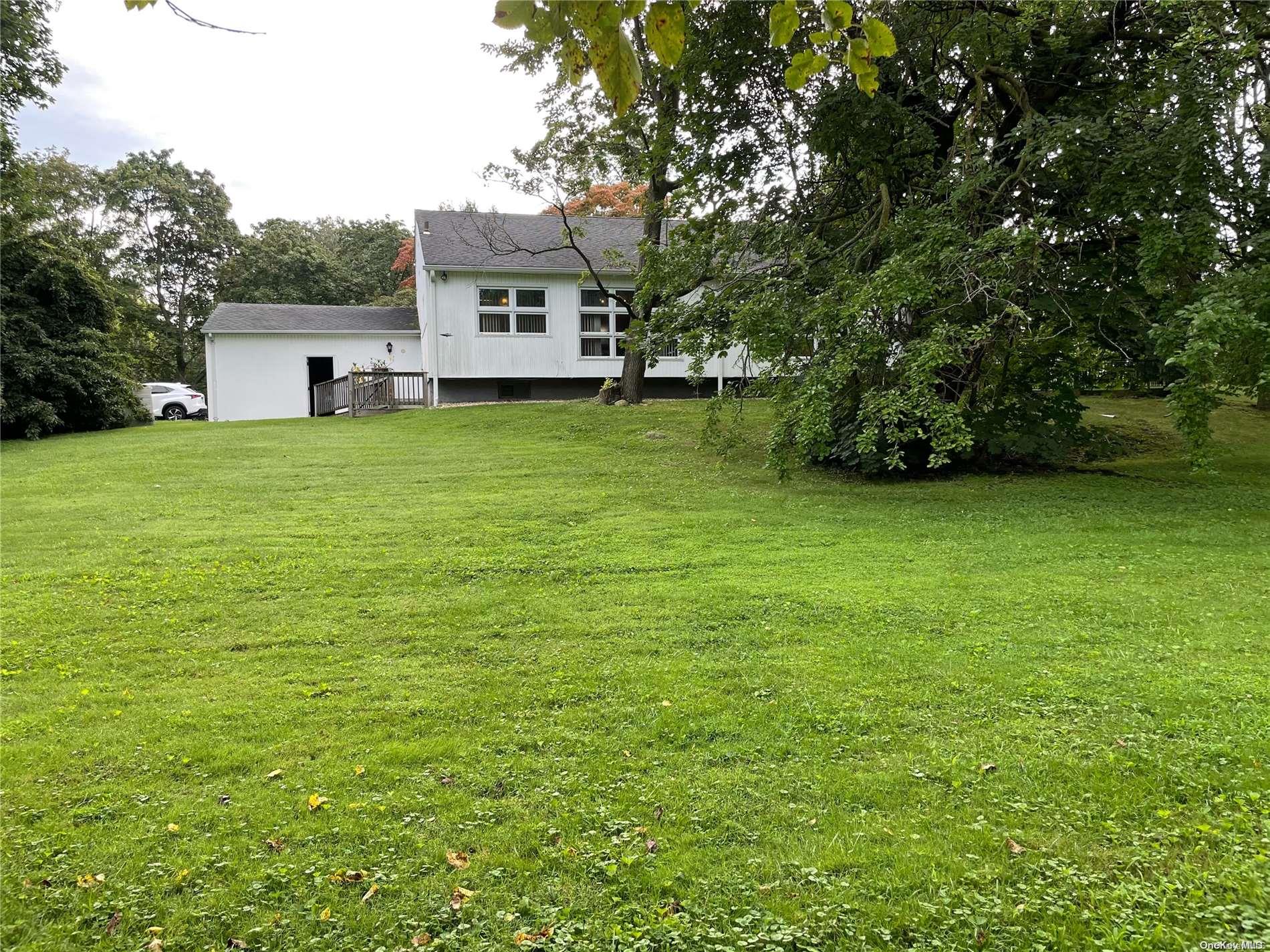 417 East Shore Road Great Neck, NY 11024 - Photo 1 of 1 a view of a house with a big yard
